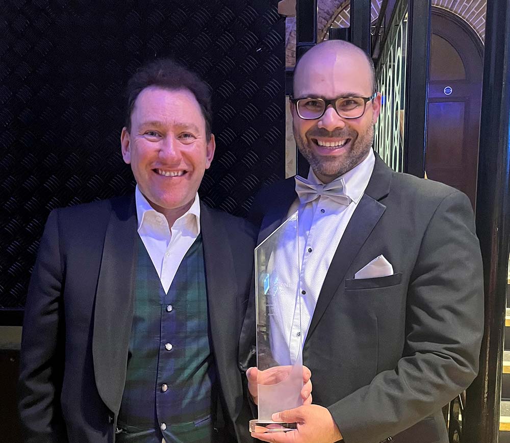 Ian Gordon and Aaron Dunning-Foreman holding the Pensions Litigation Firm of the Year award at the Professional Pensions UK Pensions Awards 2024 event.